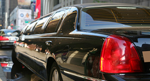 Photo of a limousine driving through the city